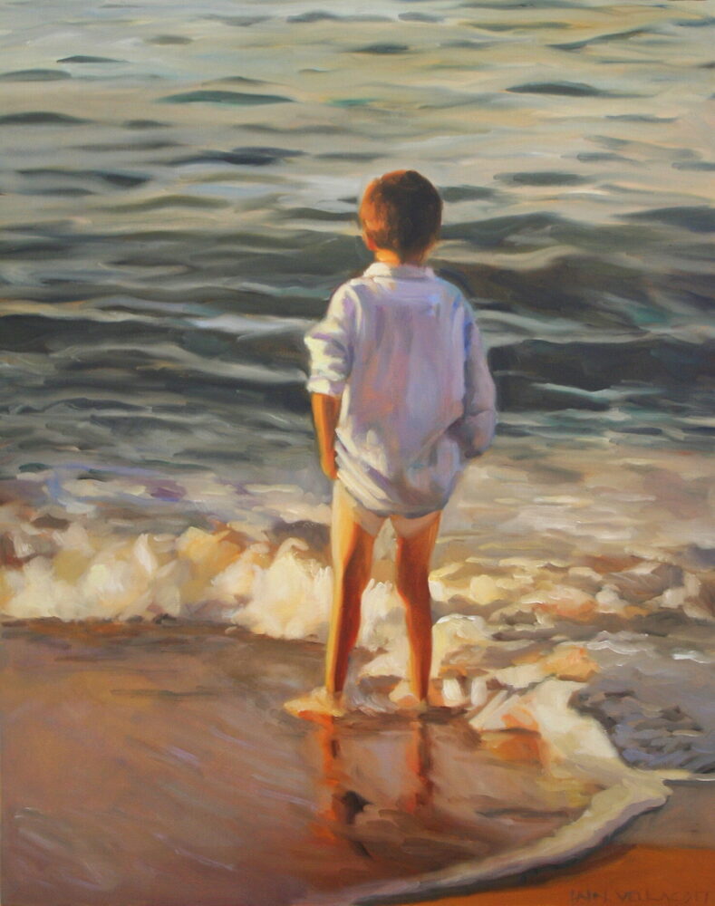 Oil painting of a boy paddling at the water’s edge on a French beach, by Iain Vellacott